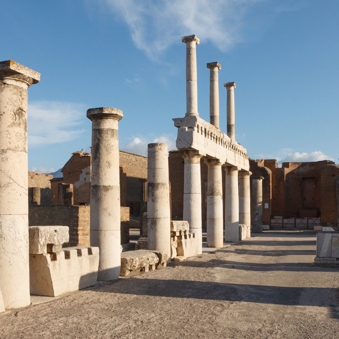 Doric columns of the Forum at the Pompeii archaeological site at sunrise