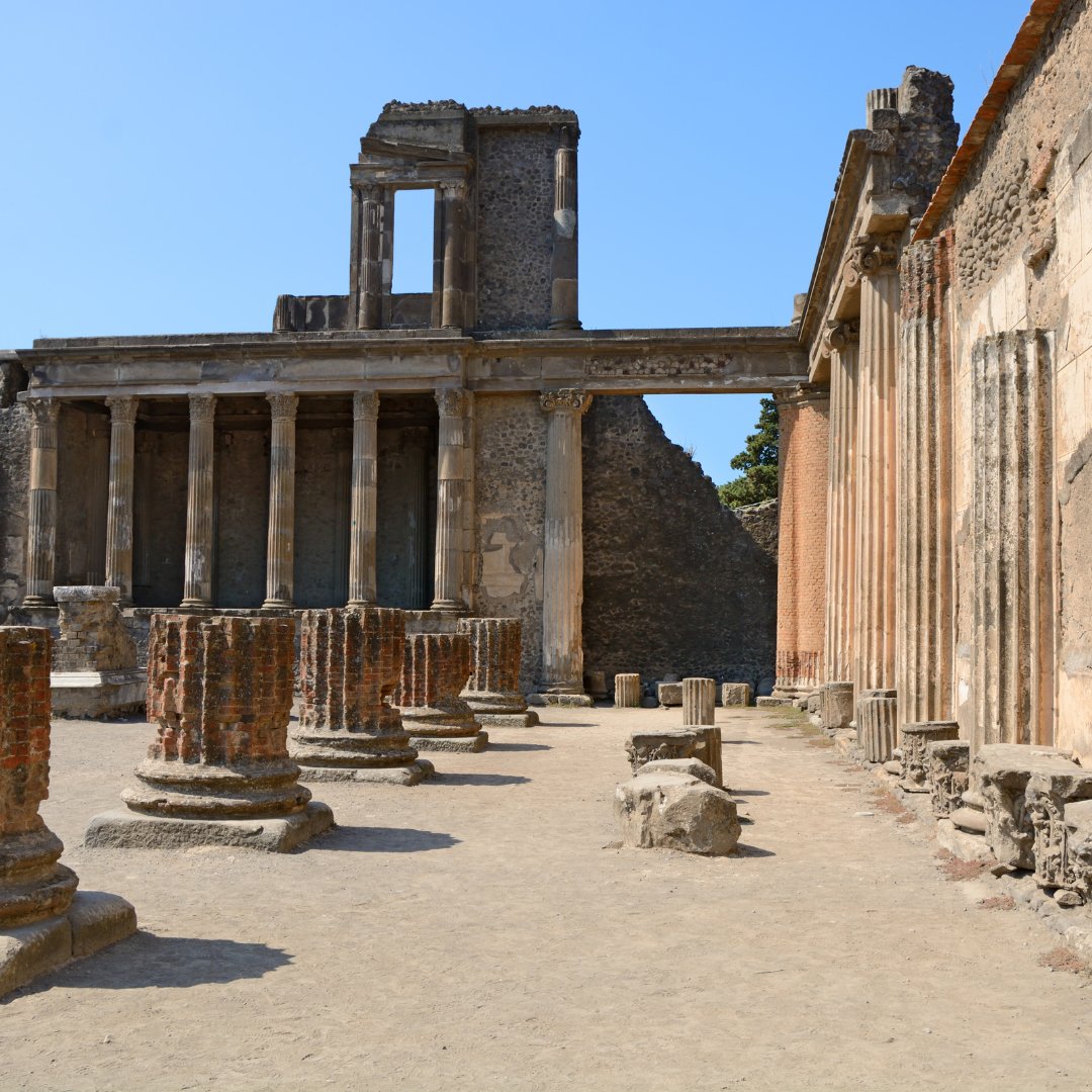 Towering columns and entablature of the Basilica inside the Pompeii archaeological park